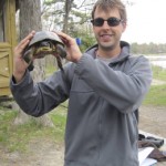 Bob Christensen holds a Blanding's turtle up to the camera.